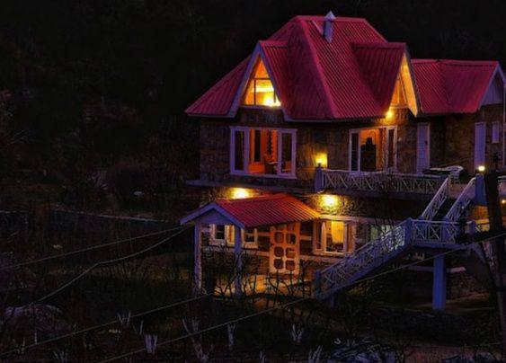 Orchard Villa lit up at night