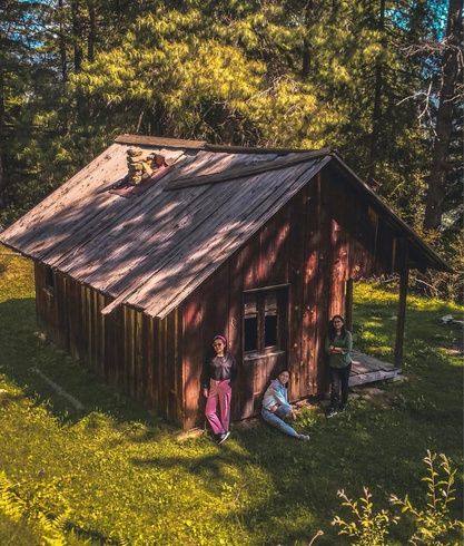 Wooden forest cabin in a sunny Kaisdhar meadow